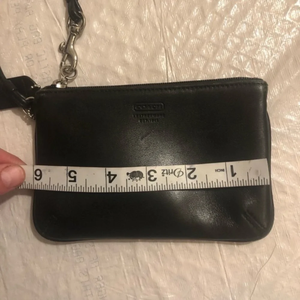 Coach black leather wristlet bag